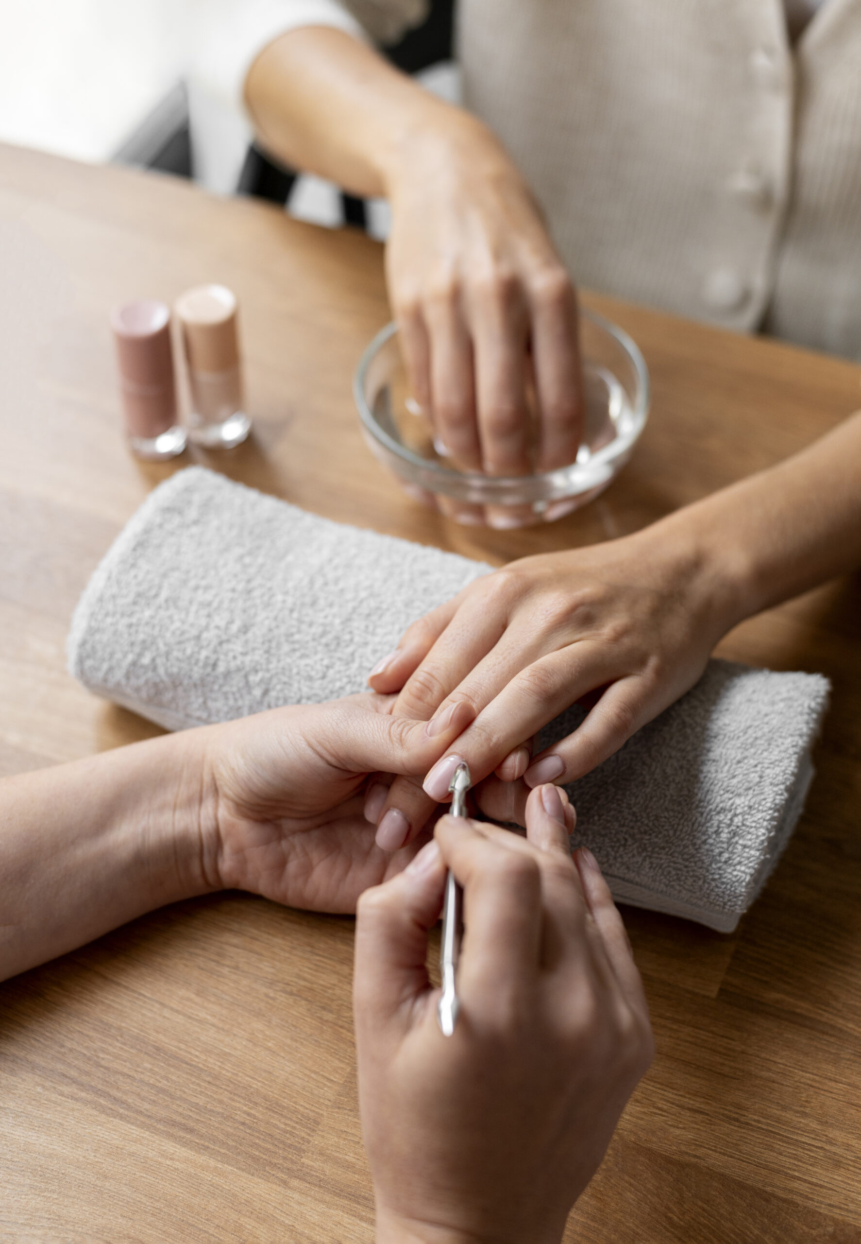 close-up-manicurist-holding-nail-tool